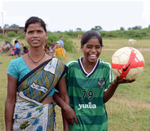 Beneficiaries of the program share a light moment in between the training. 