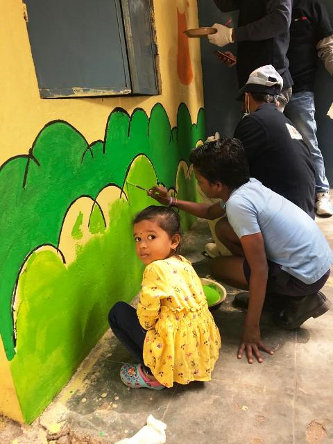 TKM Employees taking part in mural painting with school children