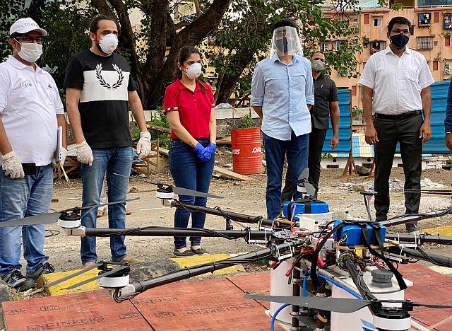 Embassy Services team and Aaditya Thackeray with a disinfectant drone