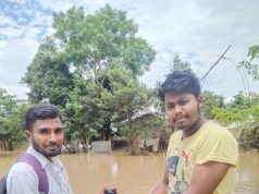 A flood affected victim receiving cash out of PayNearby's Micro ATM