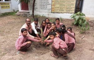 Children of Team Balika Initiative planting saplings at a school in Uttar Pradesh