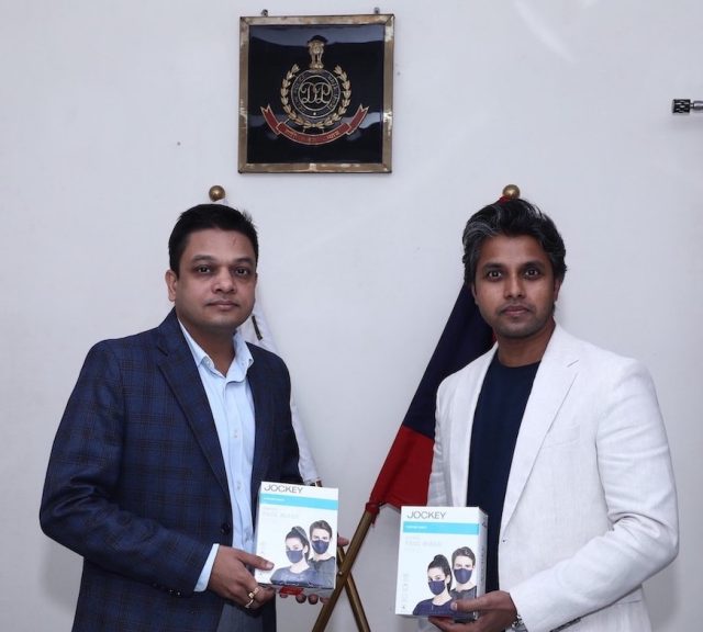 Shashank Jaiswal, DCP (Traffic, Headquarter), Delhi, receiving masks from Karthik Y, Chief Sales and Marketing, Page Industries