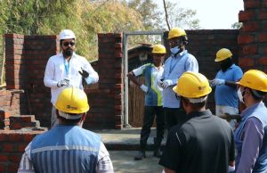 Mr. Ritesh Kamble, Deputy Manager- Technical Engineering, Habitat for Humanity India, leads a safety briefing at the Build site, ensuring all participants are prepared for the Volunteer Build.