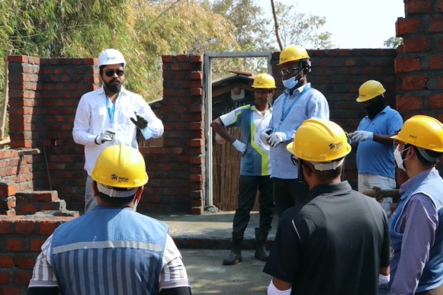 Mr. Ritesh Kamble, Deputy Manager- Technical Engineering, Habitat for Humanity India, leads a safety briefing at the Build site, ensuring all participants are prepared for the Volunteer Build.